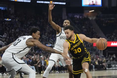 Stephen Curry’s big fourth quarter sends Warriors past Nets 124-120 to end three-game skid